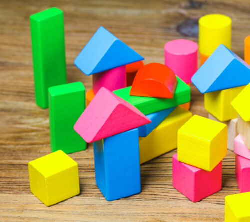building-blocks-wooden-background-colorful-wooden-building-blocks