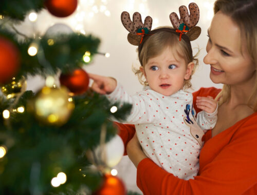 charming-baby-mommy-decorating-christmas-tree