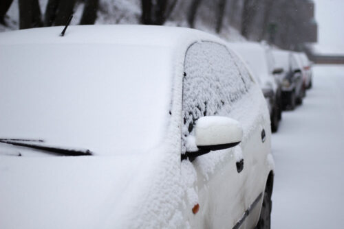 closeup-snow-covered-car-street-during-winter